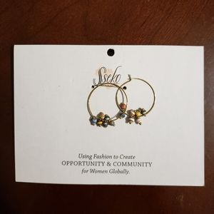 Tiny hoop earrings in rainbow